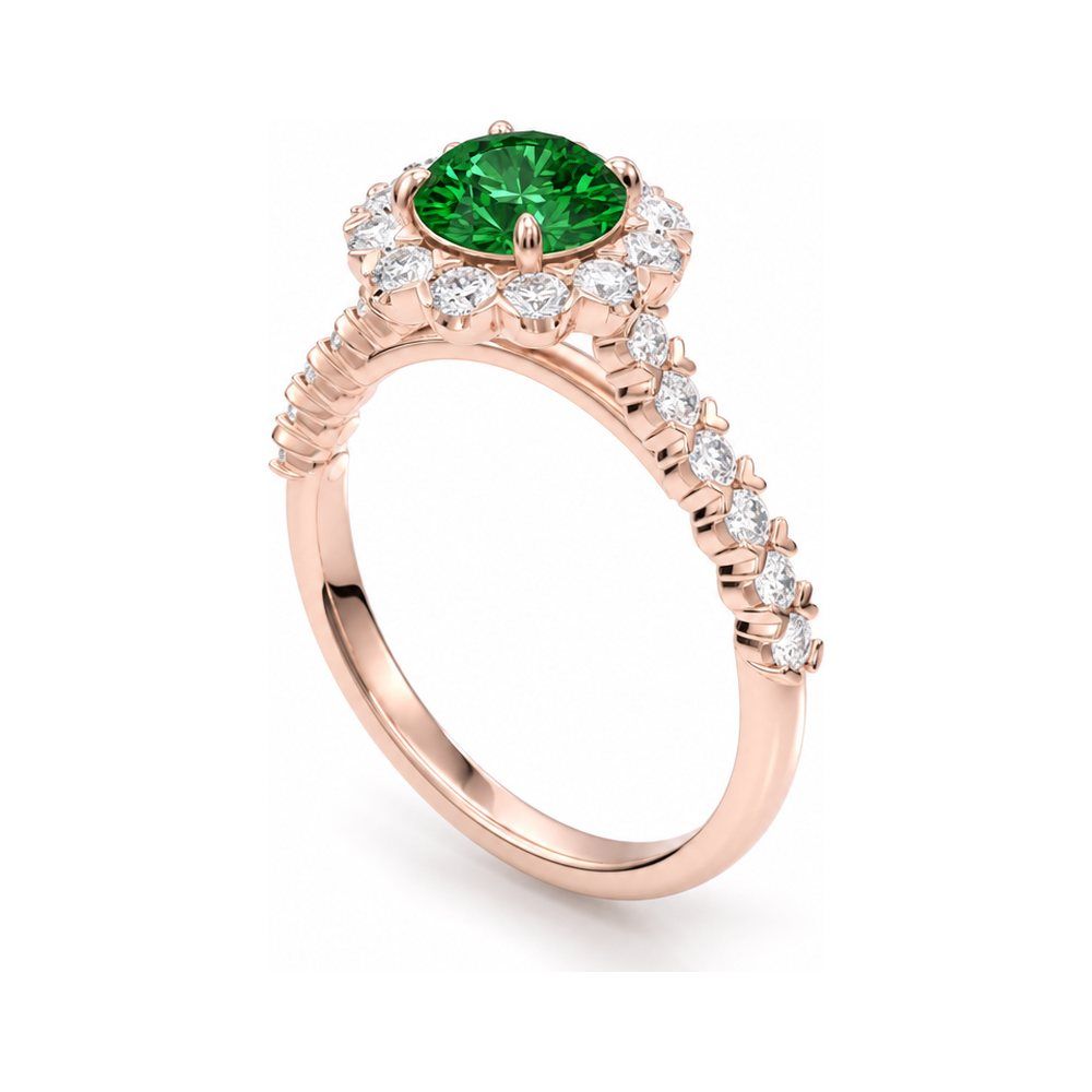 The same halo ring rendered as a product photo in rose gold with an emerald centre stone and diamond halo