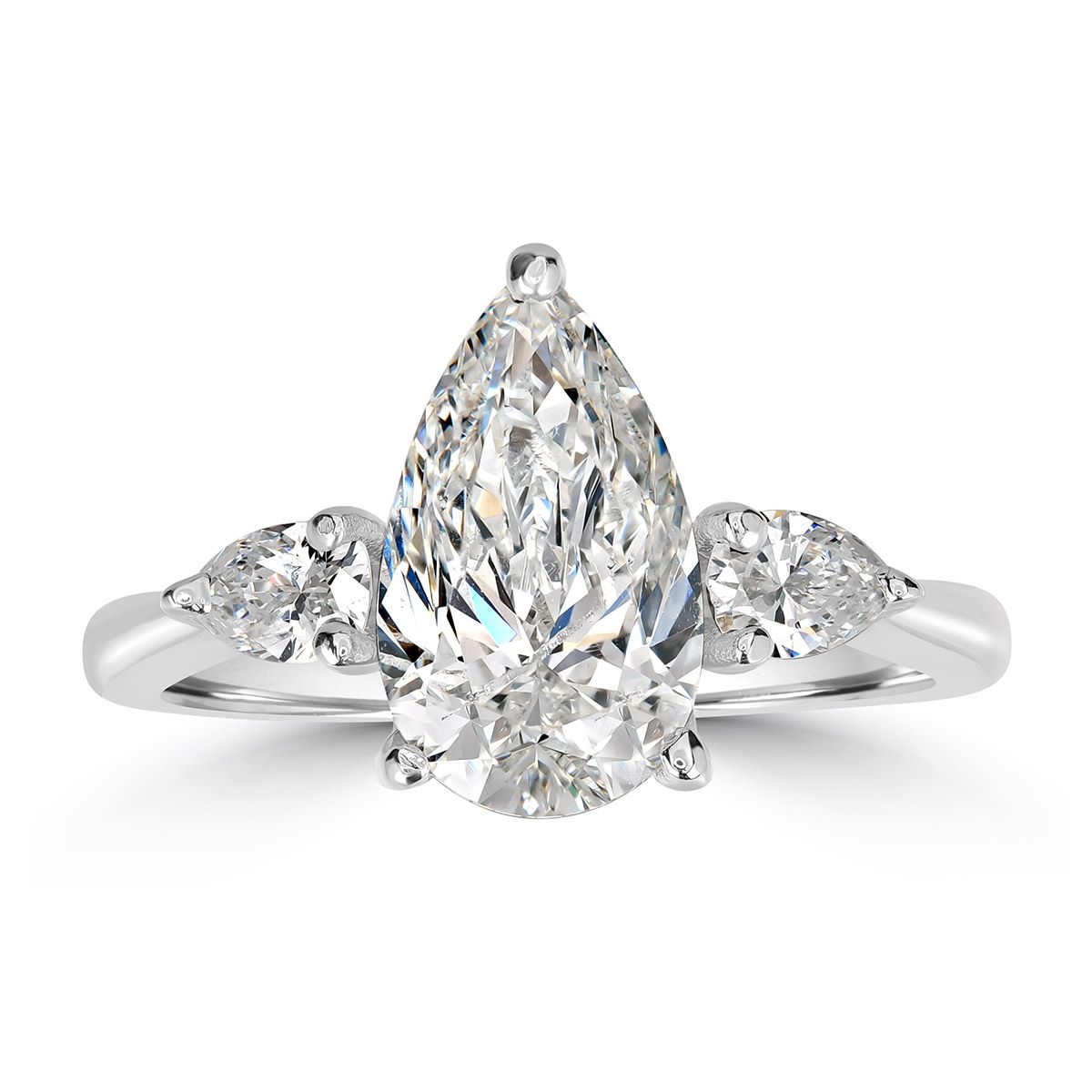 A pear-cut diamond after AI retouching — the facet pattern and the fire are identical in both shots; only the dust, the marks and the grey background are gone.